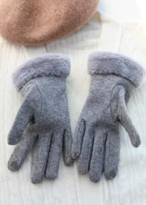 Close-up of cozy grey winter gloves featuring soft faux fur cuffs for cold weather.