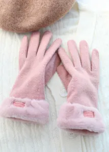 Pink winter thermal gloves with cute plush fur cuffs and soft knitted fabric, detailed close-up shot.