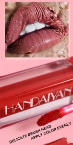 Close-up detail of HANDAIYAN matte liquid lipstick brush head and smooth lip makeup effect.