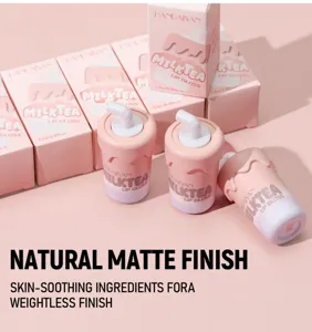Milk tea cup lip gloss detail view, cute packaging, smooth matte finish makeup product.