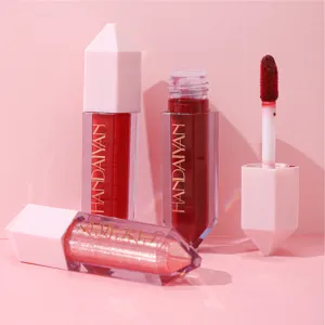 Detail view of matte and glitter liquid lipstick set, showing smooth texture and applicator.