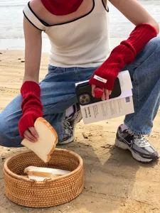 Red wool arm warmers winter long half finger gloves knit sleeves soft warm apparel item.