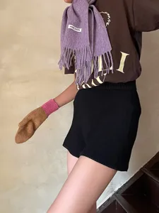 Detail view of the warm winter wool scarf with fringe, paired with cozy daily apparel.
