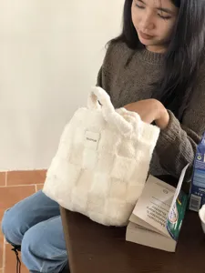 Plush checkered handbag detail view, soft fuzzy winter tote bag for women and girls daily use.