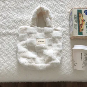 Fluffy checkered plush tote bag for women, cozy winter handbag with soft faux fur design.