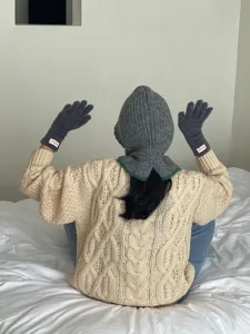 Cozy knit balaclava hood and fuzzy gloves detail shot, perfect winter warm fashion outfit style.