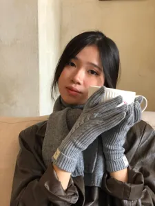 Winter warm women cable knit gloves and matching gray scarf detail view for cold weather style.