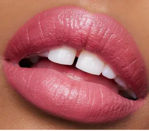 Matte liquid lipstick lip gloss makeup product detail macro shot showing smooth and rich color.