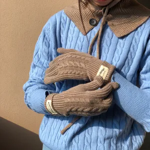 Brown cable knit winter gloves detailed view, cozy woolen thermal mittens for women.