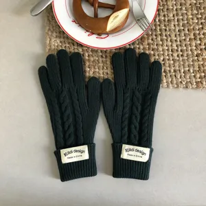 Winter warm dark green knitted cable five-finger gloves for women, cozy winter thermal wear.