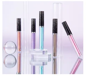 Detail shot of shimmering liquid eyeshadow tubes featuring fine glitter for stunning eye makeup.