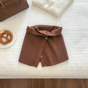Knitted neck warmer detail, solid brown winter scarf with stylish buttons, cozy texture.