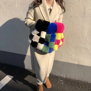 Close-up of stylish checkered plush handbag, fluffy texture, perfect winter fashion accessory.