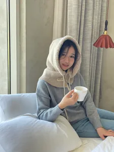 Cozy knitted balaclava hooded scarf in beige, fleece lined winter warm beanie hat detail view.