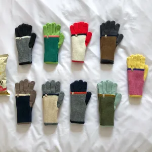 Detailed view of women's color block knit gloves, double layer touch screen warm gloves.