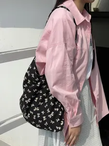 Black canvas shoulder bag with cute white bow print, casual lazy style daily student tote.