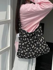 Black canvas shoulder bag with white bow print, casual lazy style daily student tote bag.