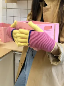 Detailed view of women's color-block knitted gloves, dual-layer warm touch screen design.