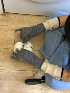 Women knitted color block arm warmers long gloves detail view showing soft texture and cozy fit.