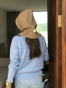 Cable knit hooded scarf and cozy sweater detail view, stylish autumn winter warm knitwear.