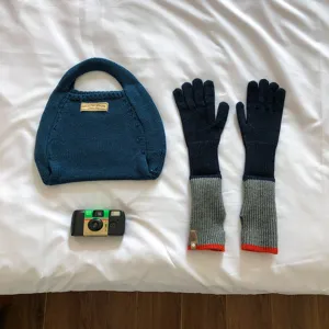 Knit handbag and long gloves set, cozy winter warm accessories in stylish dark blue and grey.
