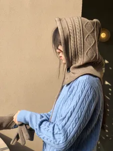 Knit hooded scarf hat and sweater detail view, cozy winter fashion style with button and drawstring.