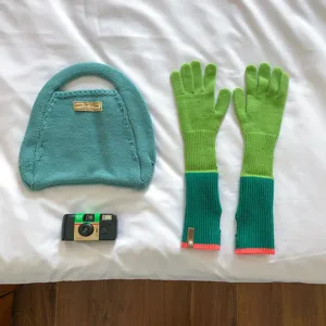 Knitted color-block gloves and matching handbag set, stylish long winter warm accessory.