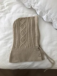 Beige knitted balaclava hood scarf detail, cozy cable knit winter neck warmer with buttons.
