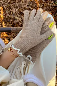 Detail view of women's touchscreen knit gloves, cozy wool blend for winter warmth and style.