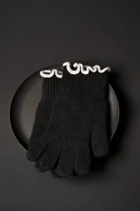 Black knit gloves women winter touchscreen wool gloves with elegant ruffles detail view.