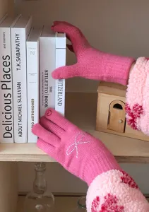 Cute pink knit gloves with rhinestone bow and plush cuffs, perfect for winter daily wear.