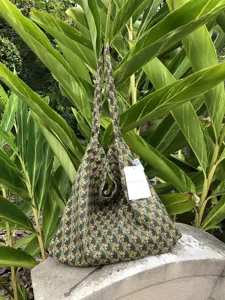Floral print canvas tote bag detail view, casual shoulder bag with natural pattern.