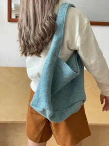 Light blue fuzzy wool tote bag detail, soft texture and large capacity for casual everyday use.