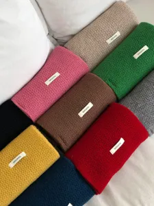 Multicolor 100% wool scarves detailed display, soft texture and warm winter accessory.
