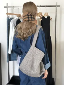 Detailed view of the winter woolly tote bag in grey, showing soft texture and large capacity.