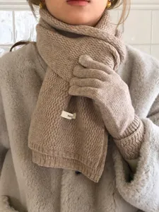 Cozy knit wool scarf and gloves set in camel, elegant winter warm accessory detail shot.