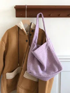 Cozy purple wool tote bag detail shot, stylish and spacious shoulder bag for autumn and winter daily use.