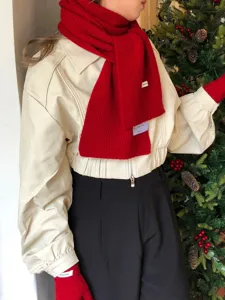 Cozy red wool knit scarf for women, warm winter fashion accessory with chic seasonal style.