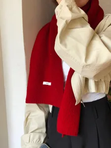 Women's winter warm wool scarf, classic red knitted design, elegant daily wear accessory.