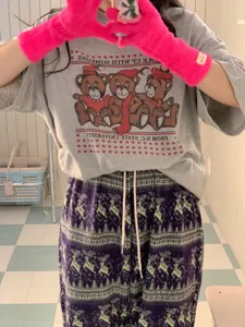 Cozy dopamine fuzzy winter gloves and retro graphic t-shirt matching casual outfit.