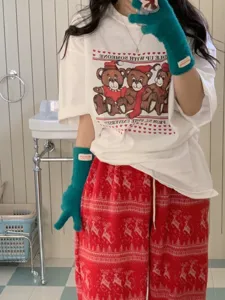 Cozy winter fuzzy gloves paired with casual t-shirt and holiday lounge pants, warm and stylish.