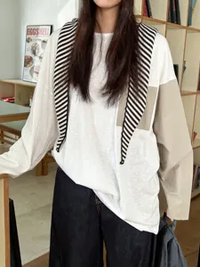 Women's stylish casual long sleeve color block top with integrated striped scarf detail.