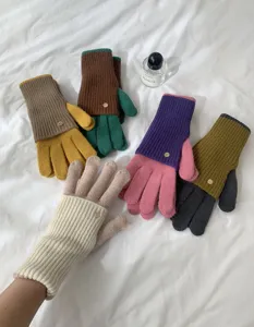Closeup detail of colorful knitted winter gloves showing soft texture and cozy warmth.