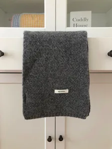 Dark grey wool scarf detailed shot, 100% wool soft winter warm cozy knitted winter fashion shawl.
