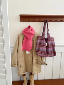 Cozy winter woolen plaid large capacity shoulder bag displayed in a stylish lifestyle setting.