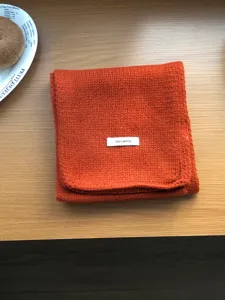 Orange 100% wool knitted scarf winter cozy solid warm neckerchief detail closeup view