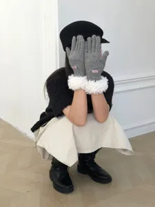 Winter warm knit gloves with plush cuffs detail shot, soft wool material, stylish daily wear.