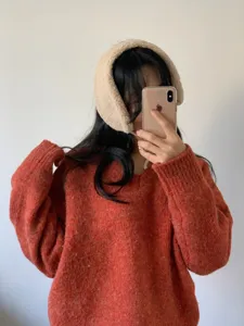 Cozy plush winter earmuffs for women, warm fleece ear warmers, stylish cold weather accessories.