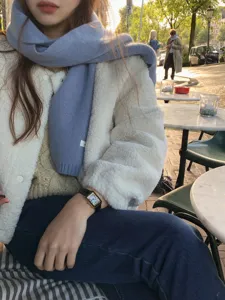 Cozy fog blue solid wool scarf detail shot, elegant winter fashion accessory for women.