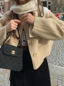 Stylish winter wool scarf and jacket outfit combination, warm and elegant street style look.